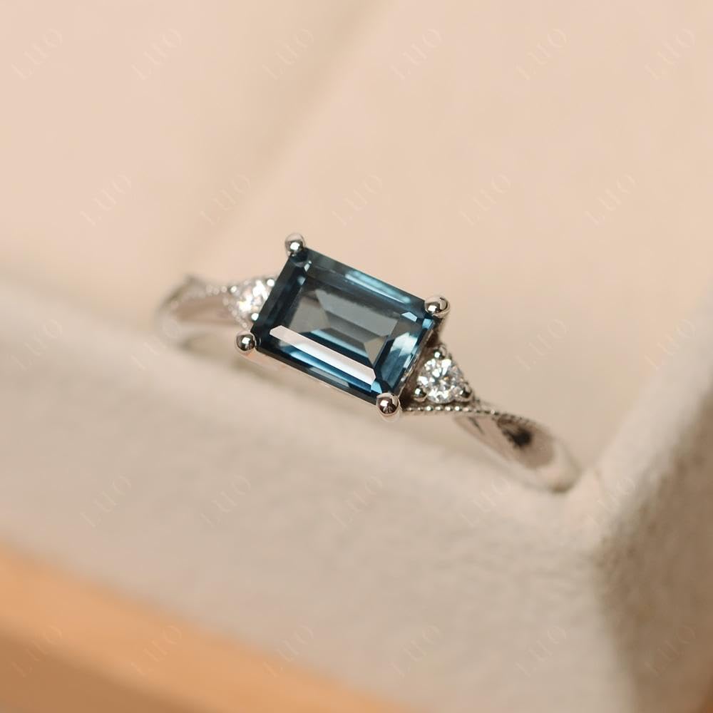 Topgemco East-West London Blue Topaz Ring – Emerald Cut Sterling Silver December Birthstone Ring