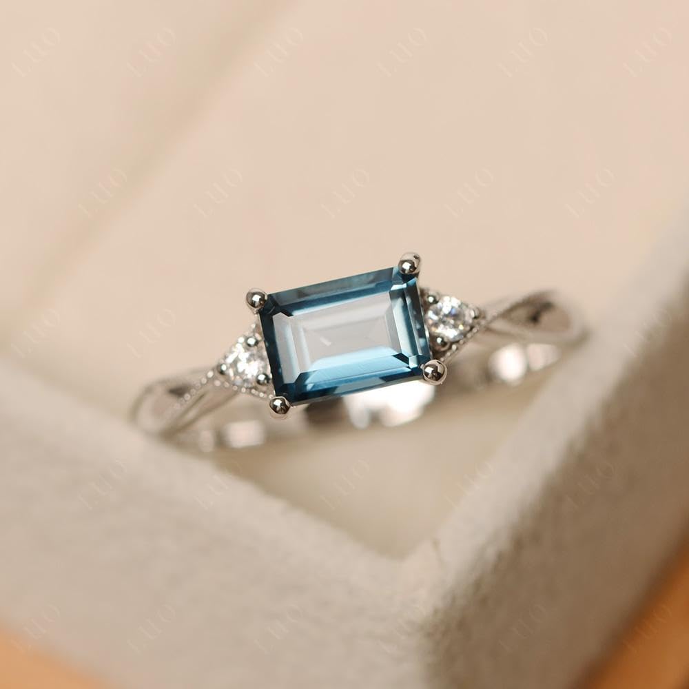 Topgemco East-West London Blue Topaz Ring – Emerald Cut Sterling Silver December Birthstone Ring