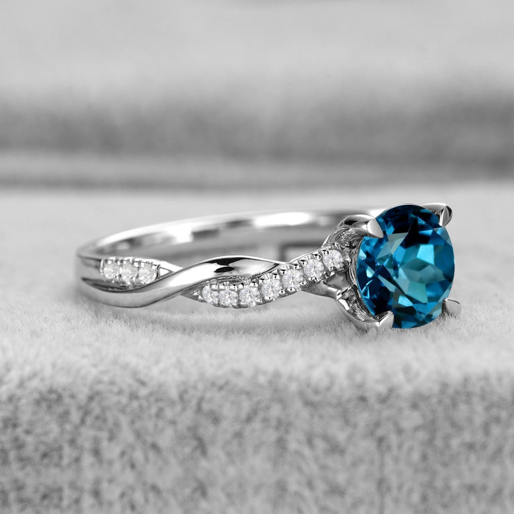 Topgemco Twisted London Blue Topaz Ring – Round Cut Sterling Silver December Birthstone Ring