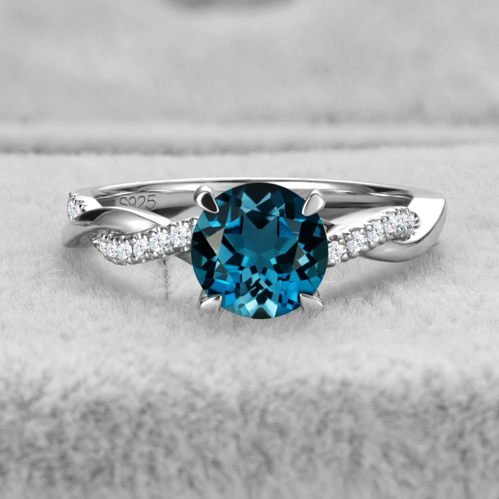 Topgemco Twisted London Blue Topaz Ring – Round Cut Sterling Silver December Birthstone Ring