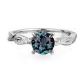 Topgemco Twisted Infinity Ring – Round-Cut Alexandrite in 925 Sterling Silver, Sizes 3–13