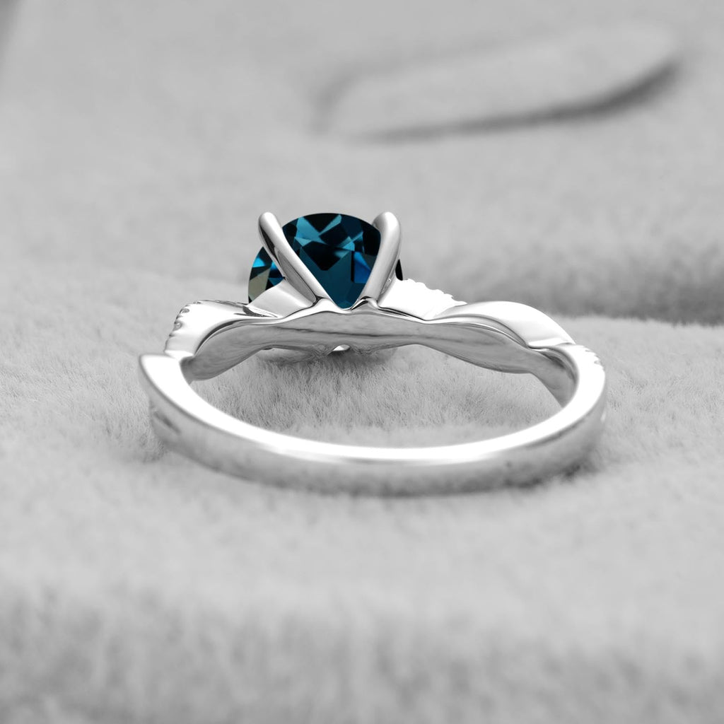 Topgemco Twisted London Blue Topaz Ring – Round Cut Sterling Silver December Birthstone Ring