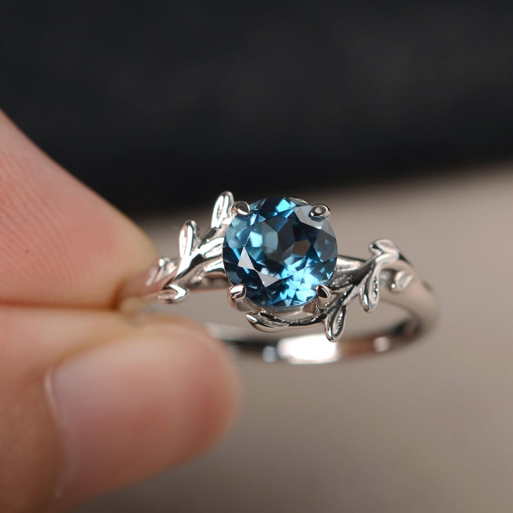 Topgemco London Blue Topaz Leaf Bypass Ring – Round Cut Sterling Silver December Birthstone Ring for Women